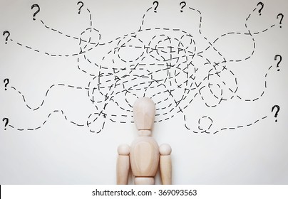 Man under stress because of too much problems. Abstract image with a wooden puppet - Shutterstock ID 369093563