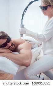 Man Under Treatment In A Hair Removal Studio