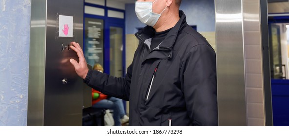 A man undergoes treatment in an automatic disinfecting tunnel entering the hospital. - Shutterstock ID 1867773298