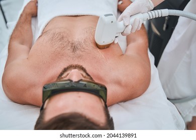 Man Undergoing The Laser Chest Hair Removal