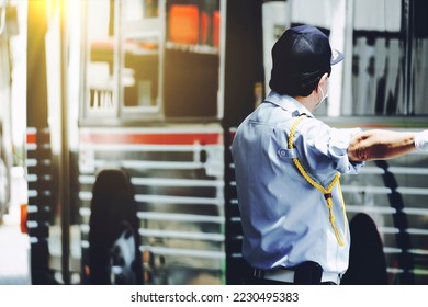 man in uniform directing traffic