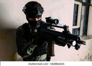 Man In Uniform Of Special Military Police Unit From Croatian Army. He Is Equipped With Tactical Gear And Assault Rifle.