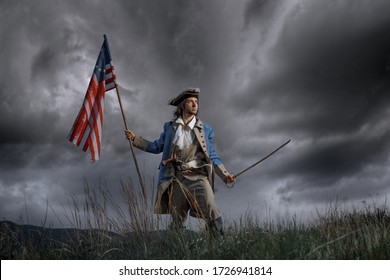 Man in United States War of Independence soldier costume with flag posing in forest. 4 july independence day of USA concept photo composition