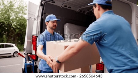 Man Unloading Boxes From Van For Removal And Delivery Service, Teamwork.