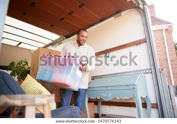 Man Unloading Furniture Removal Truck Outside Stock Photo Edit