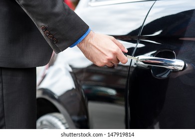 Man Unlocking The Door Of His Car, Cropped Image