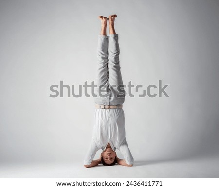 man upside down on white background with free space for text