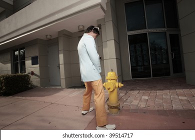 Man urinating on a fire hydrant