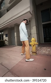 Man urinating on a fire hydrant