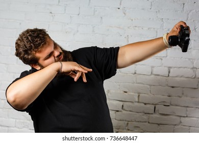 a man use camera for taking himself.