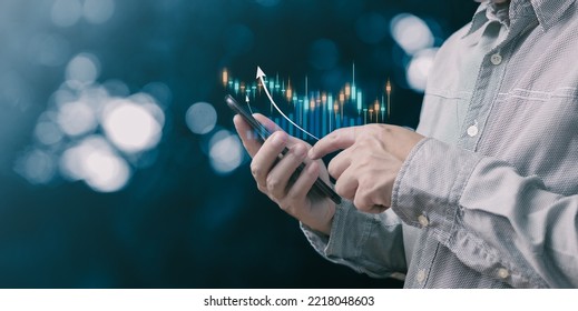 man use growth graphs and progress of business and analyze financial, and investment.Use technology to plan strategy to success goals and growth stock.online business, economic, online marketing.