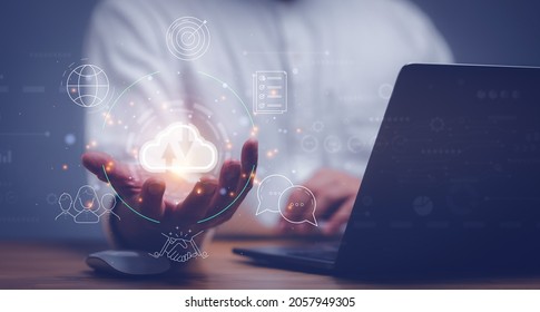man use Laptop with cloud computing diagram show on hand. Cloud technology. Data storage. Networking and internet service concept. - Shutterstock ID 2057949305