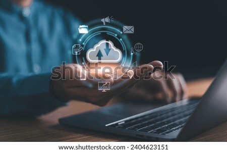 Man use Laptop with cloud computing diagram show on hand. Cloud technology. Data storage. Networking and internet service concept. Cloud Computer technology and storage online for business network.