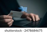 Man use laptop with online shopping digital cart with credit card for shopping payment online with application.Intelligent E-commerce,internet banking payment,financial technology. lifestyle.