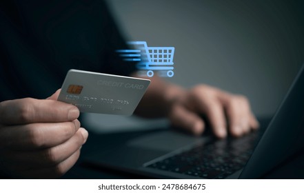 Man use laptop with online shopping digital cart with credit card for shopping payment online with application.Intelligent E-commerce,internet banking payment,financial technology. lifestyle. - Powered by Shutterstock