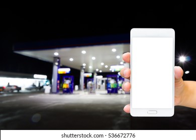 Man Use Mobile Phone, Blur Image Inside Gas Station At Night As Background.