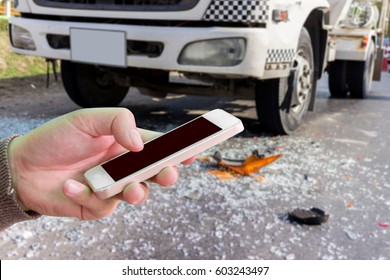 Man Use Mobile Phone, Blur Image Of Car Accident As Background.