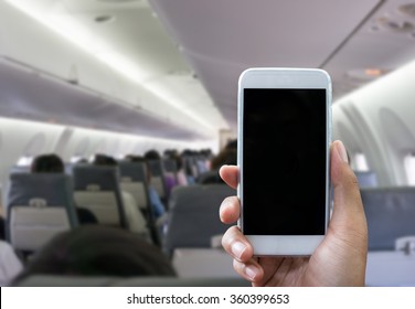 Man Use Your Phone In Airplane Blurred Background - Mockup Template