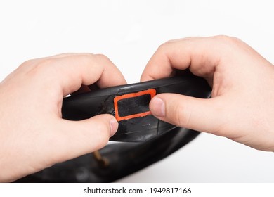 Man Uses Rubber Patches To Repair A Bicycle Camera. Broken Bike Wheel.