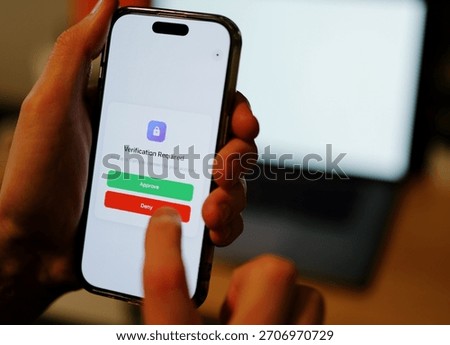 Man Uses Two Factor Authentication to Authorize Application Access Basic Enterprise Information Securtity Concept - 2FA MFA Mobile App