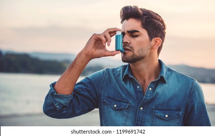 Man Using Asthma Inhaler