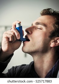 Man Using Asthma Inhaler