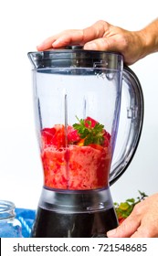 Man Using Blender To Make A Healthy Tomato Smoothie