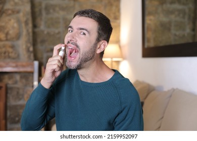 Man Using Breath Freshener Spray