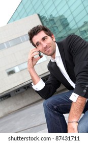 Man using cellphone in town