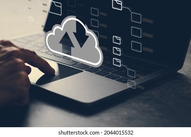 Man using cloud technology system with business information networking. Online digital data storage and connection service for download or upload via cyberspace or server. - Shutterstock ID 2044015532