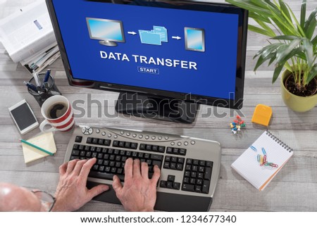 Man using a computer with data transfer concept on the screen