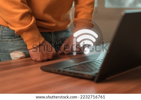 Man using a computer laptop to connect to wifi but wifi not connected, and waiting to loading digital business data form website, concept technology of waiting for connect to wifi.
