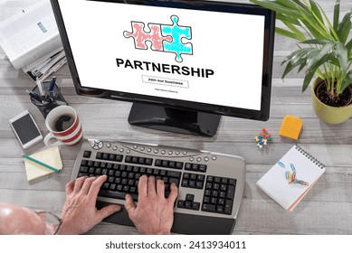 Man using a computer with partnership concept on the screen