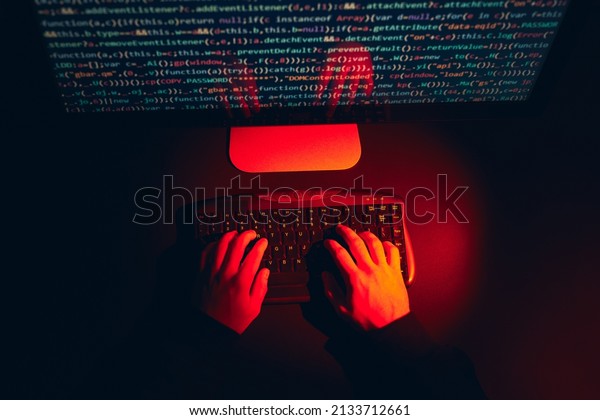 Man using computer and programming  to break\
code. Cyber security threat. Internet and network security.\
Stealing private information. Person using technology to steal\
password and private data.\
Cyber