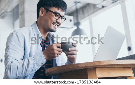 man using computer.hand typing keyboard laptop online chatting search form internet while working sitting at coffee shop.concept for technology device contact communication business people