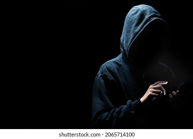 Man Using Dark Web With Smartphone. He Is Using A Smartphone. Mobile Phone Fraud.