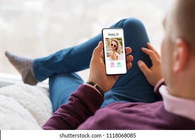 Man using dating app on mobile phone