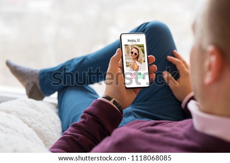 Man using dating app on mobile phone