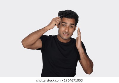 A Man Using Derma Roller For Hair Growth