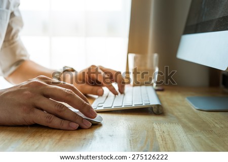 Man using desktop pc computer, mobile office concept