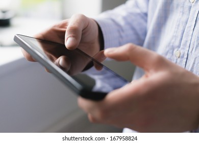 Man using digital tablet - Shutterstock ID 167958824