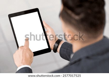 Unrecognizable male traveler sitting under rock formations