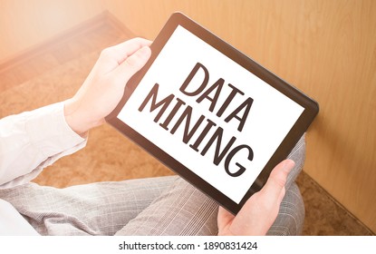 Man Using Digital Tablet, Close-up, Coffee And Keyboard On The Background. Text DATA MINING