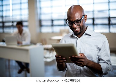 Man using digital tablet in office
