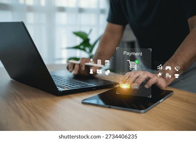 Man using digital tablet for online payment with virtual shopping cart, secure banking interface, and e-commerce technology icons for smart business concept