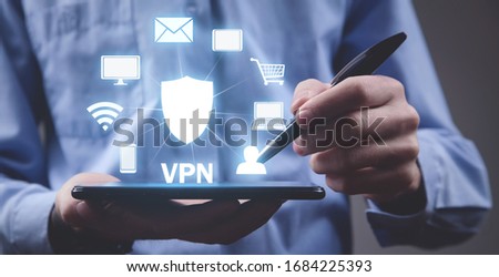 Man using digital tablet. VPN concept