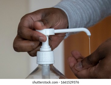 Man Using Disinfectant Hand Sanitiser To Prevent Corona Virus