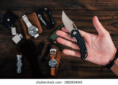 The Man Using Folding Knife. Close Up Folding Knife In Hand. EDC For Men Concept. 