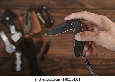 The Man Using Folding Knife. Close Up Folding Knife In Hand. EDC For Men Concept. 