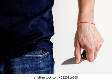 The man using folding knife. Close up folding knife in hand. EDC for men concept.